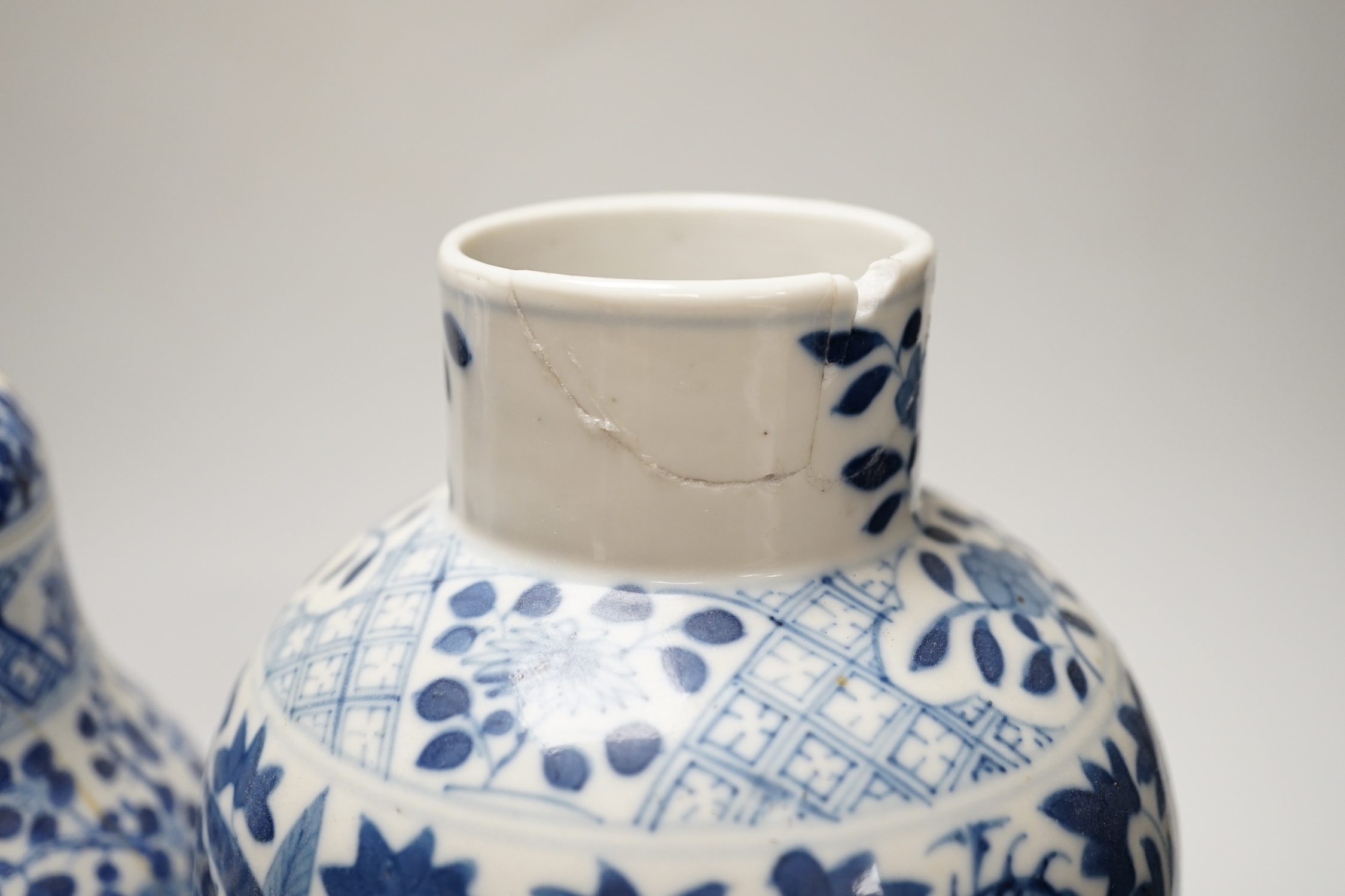 A Chinese blue and white ‘dragon’ vase and cover, and another, tallest 32cm; some damage